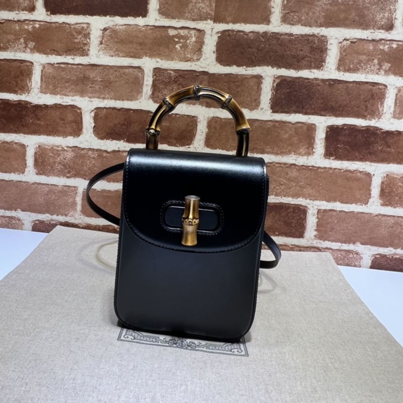 G*u*i top handle bags